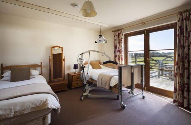 Buzzard Watch acessible bedroom with ceiling hoist and profiling bed