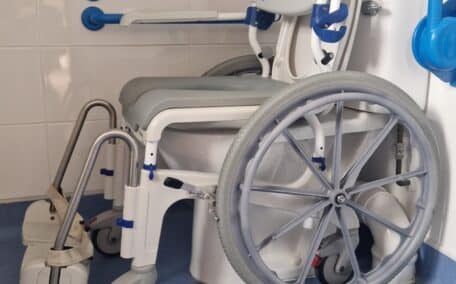 The raised toilet in the Buzzard Watch wetroom with dropdown and fixed side grab rails