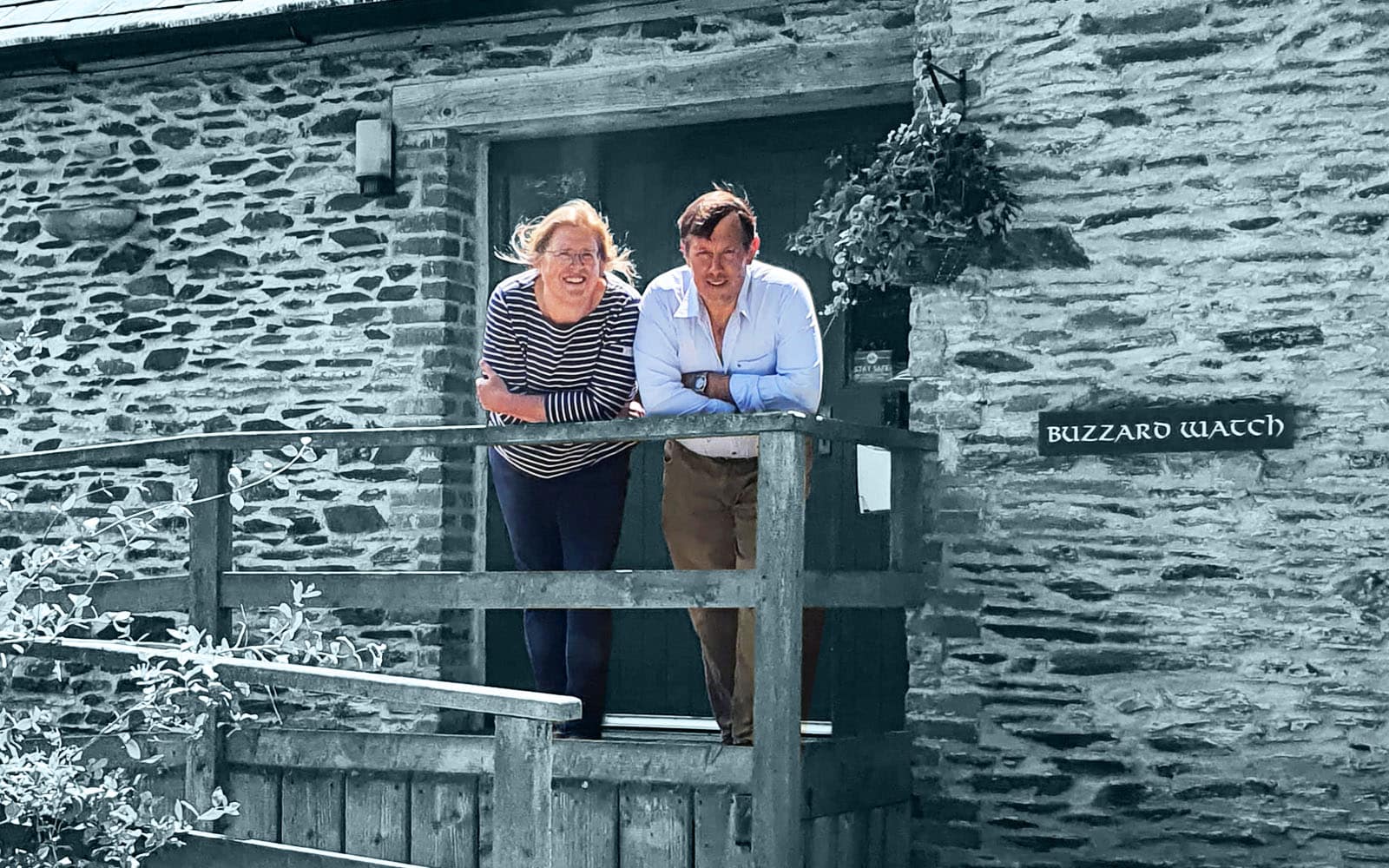 David and Esme stood on the wheelchair ramp of Buzzard Watch the 2 bedroomed cottage