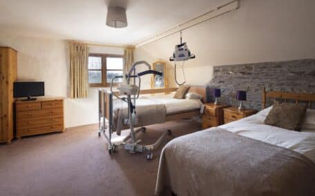 Valley View accessible bedroom with profiling bed, ceiling and portable hoisting options.