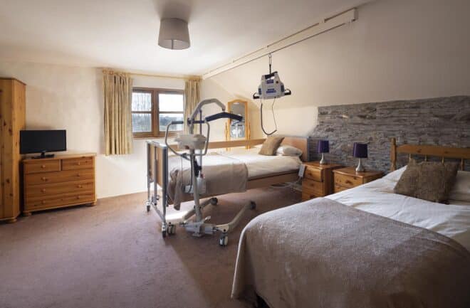 Valley View accessible bedroom with profiling bed, ceiling and portable hoisting options.