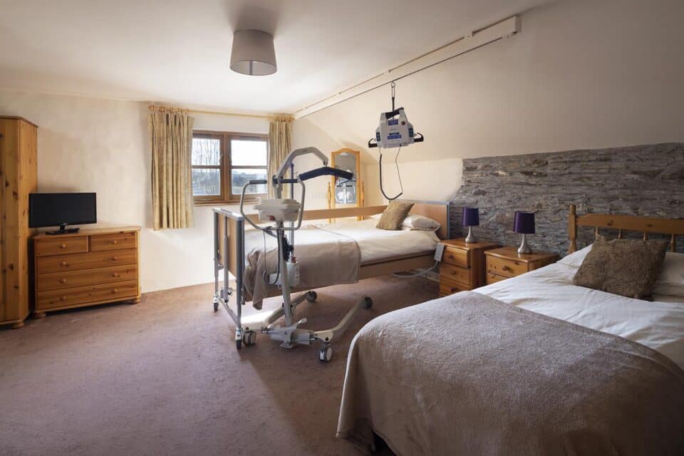 Valley View accessible bedroom with profiling bed, ceiling and portable hoisting options.