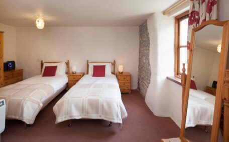 The third bedroom set up as a twin room has access outside from it's own stable door