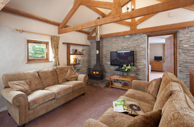 Valley View sitting room with exposed beams, Smart TV and woodburner
