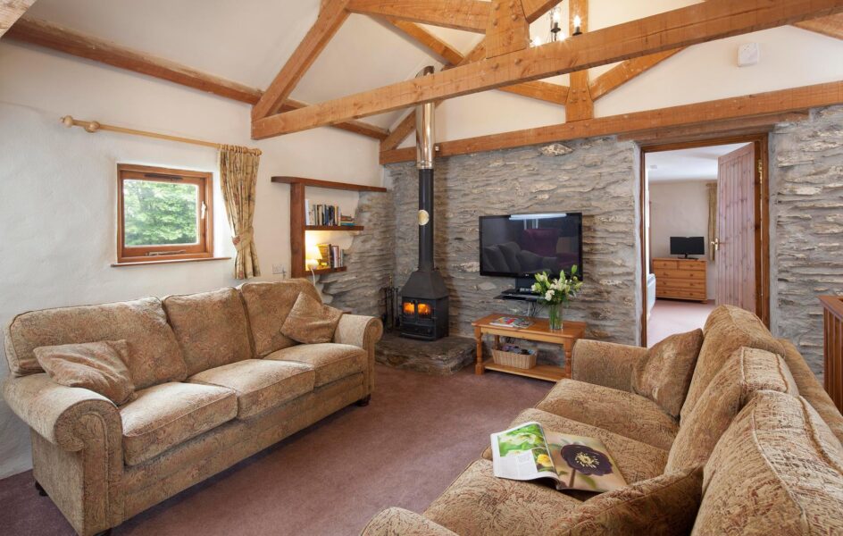 Valley View sitting room with exposed beams, Smart TV and woodburner