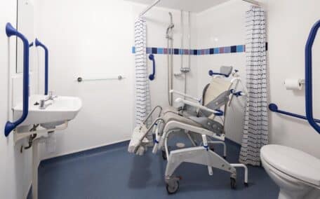 Valley View wheel in wetroom showing a reclining wheeled shower chair - one of the options available.