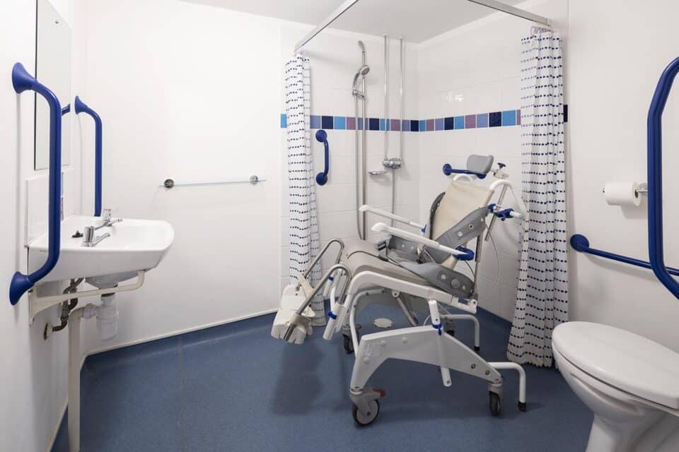 Valley View wheel in wetroom showing a reclining wheeled shower chair - one of the options available.