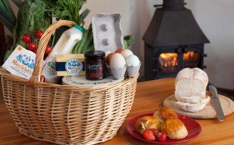 Generous welcome hamper with milk, eggs, clotted cream, butter, scones and bread