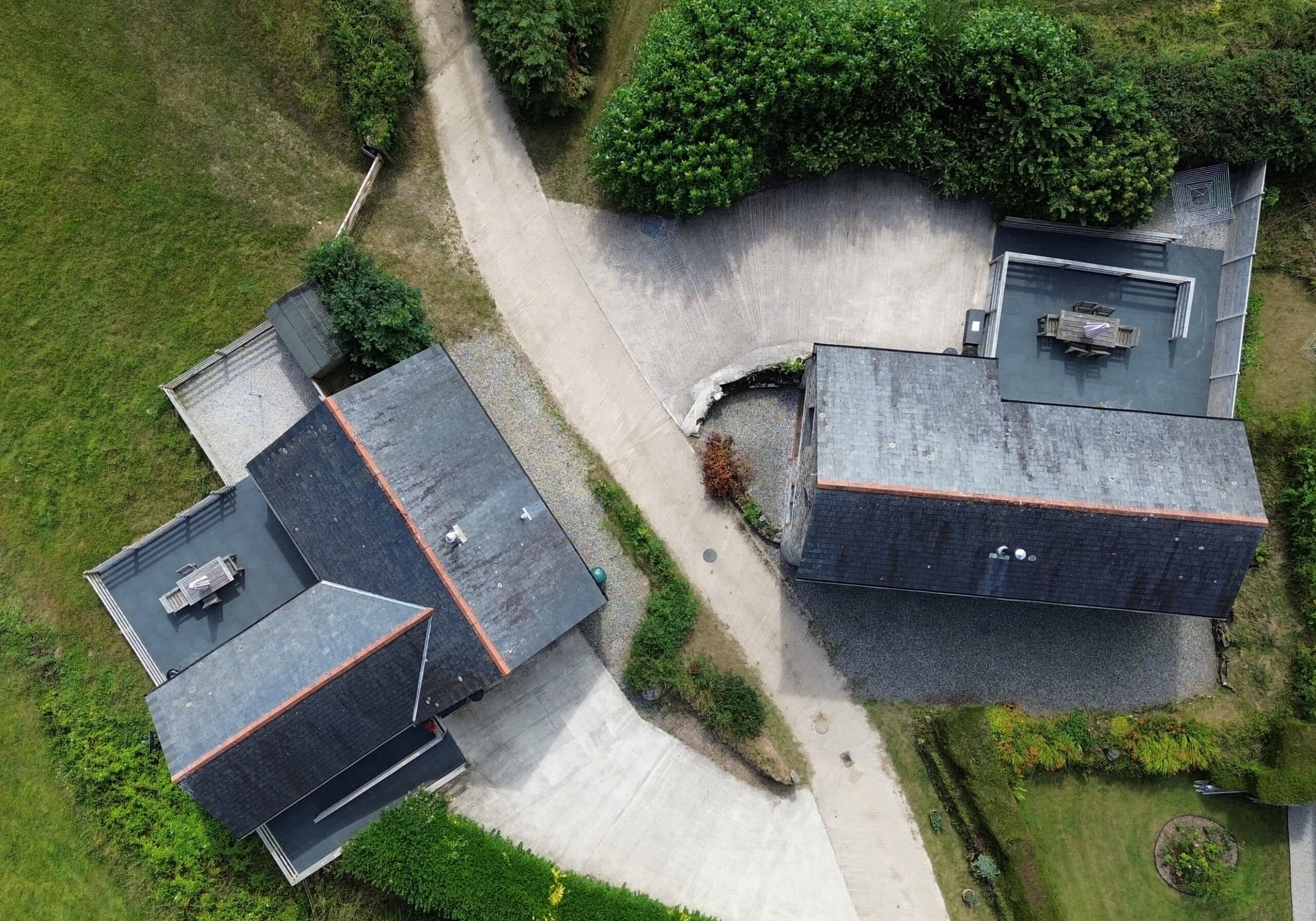 Drone picture of both cottages showing large carparks and wheelchair accessible patios